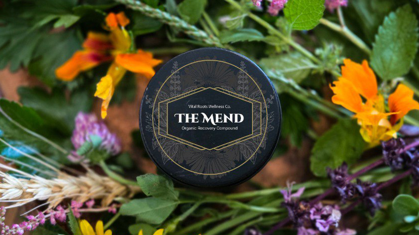 The Mend product tin among botanicals